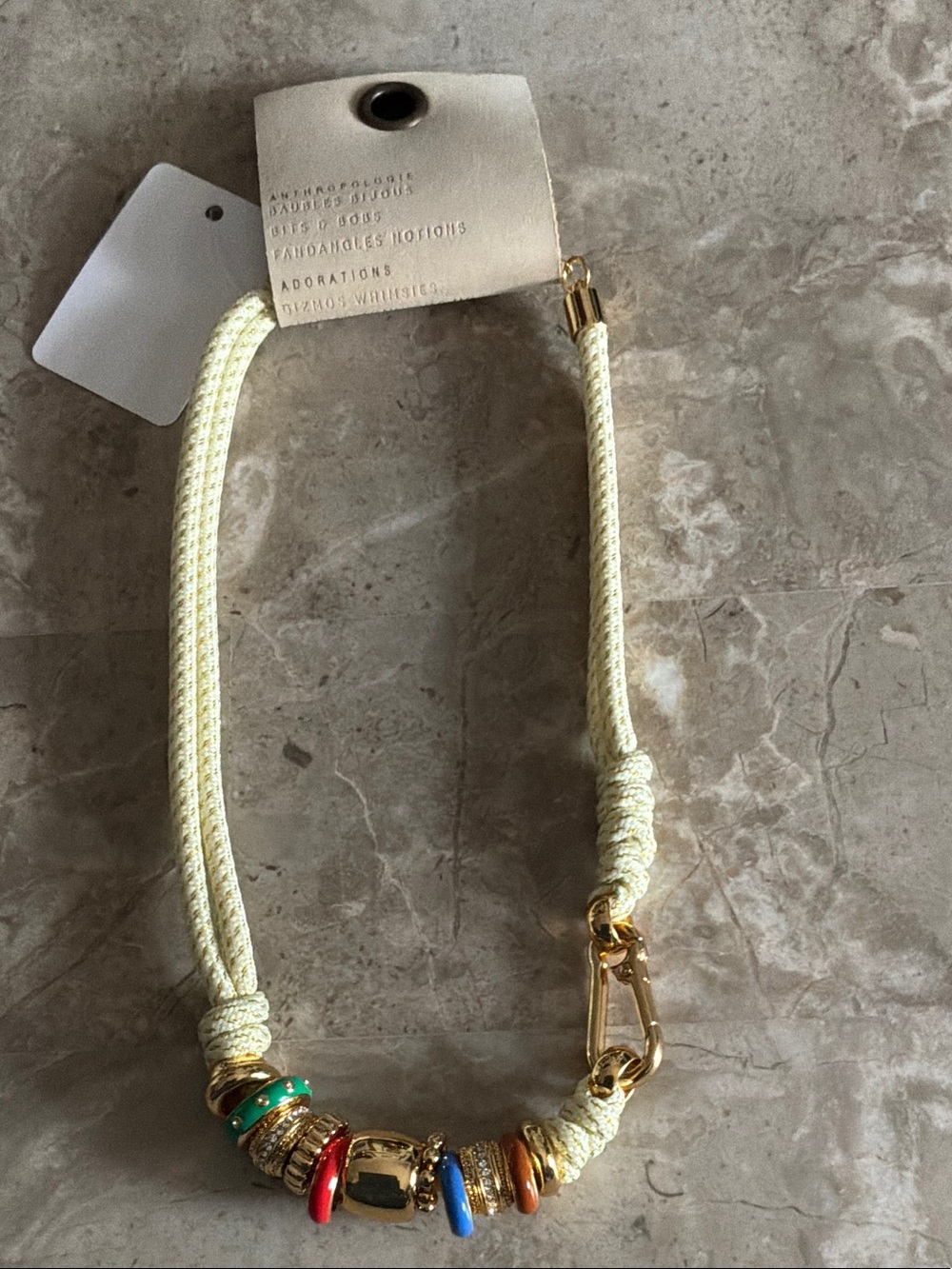 Anthropologie Cream Cord Necklace with Multicolored Accent Rings